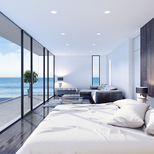Modern resort hotel interior bedroom with blurred ocean background. dof blur. 3d rendering.